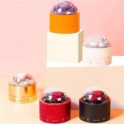 Coffrets cadeaux ronds en chocolat avec roses préservées